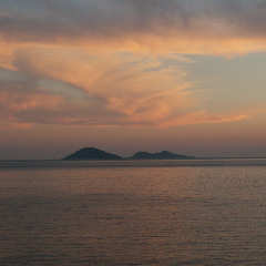 the islands in the bay at sunset